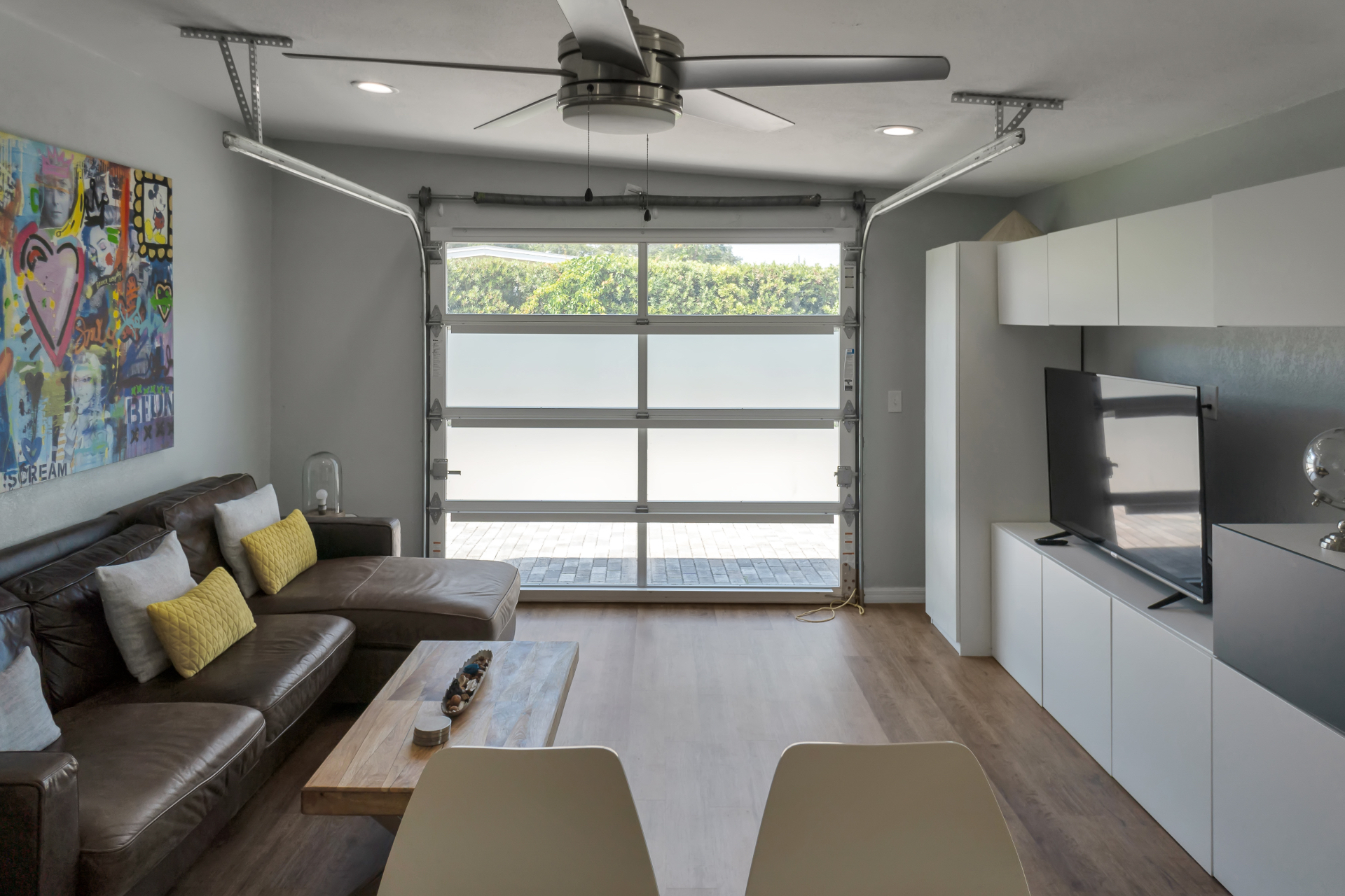 Family room with sofa and television at The Garden at Ibis