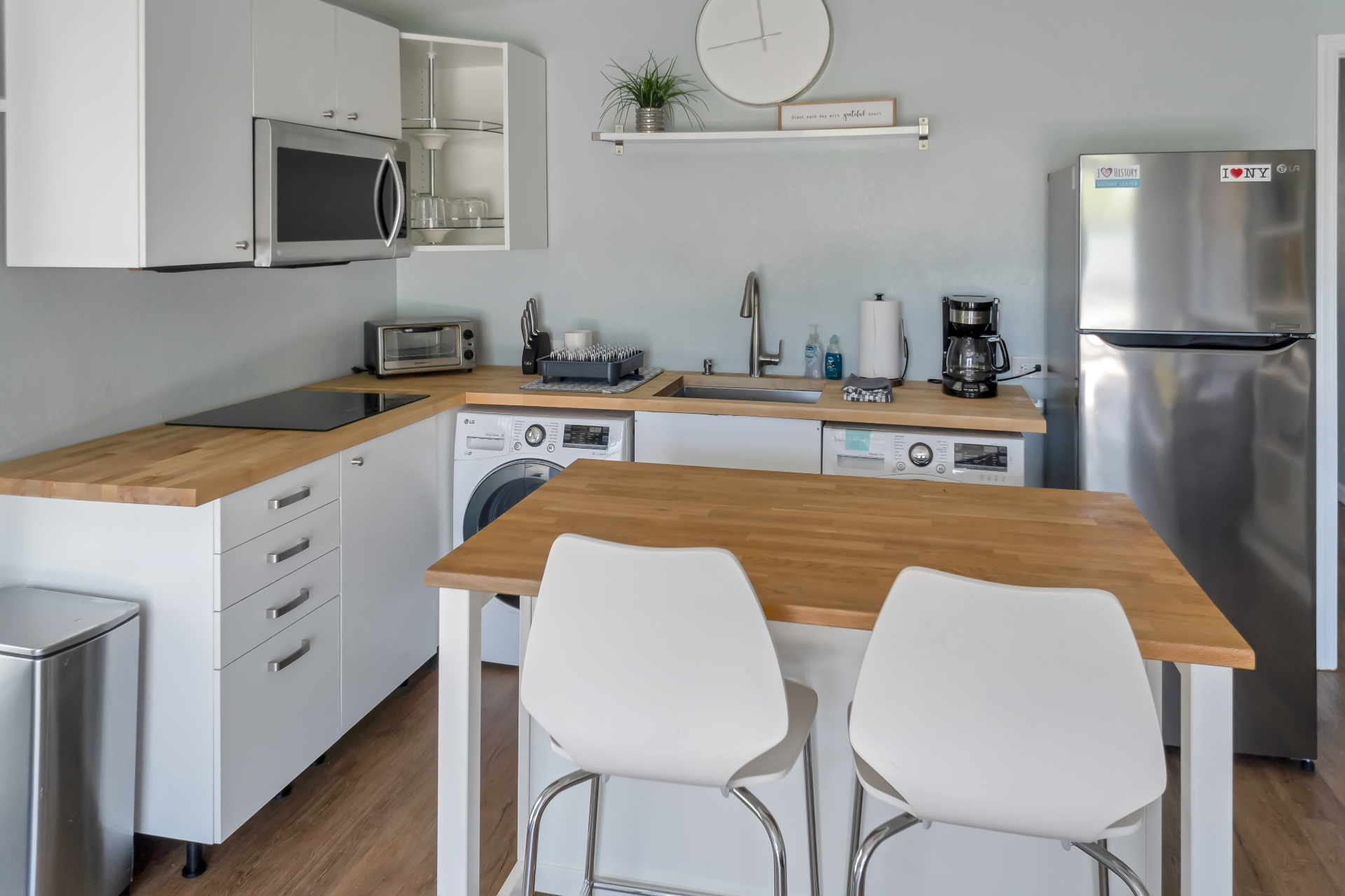 Kitchen with butcher block counters and dining seating at The Garden at Ibis